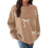 imagePRETTYGARDEN Fall Long Sleeve Pullover Sweaters for Women 2026 Trendy Crewneck Casual Cute Bow Chunky Knit Oversized SweaterCamel